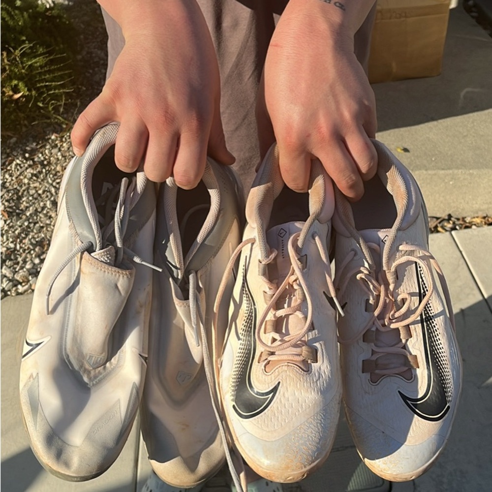 Two pairs of Nike baseball cleats